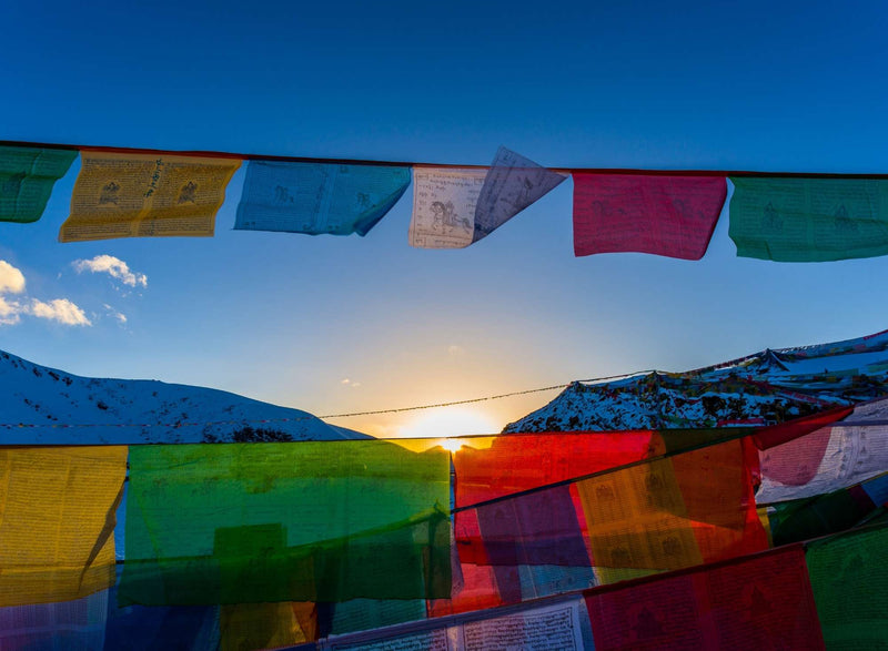 Tibetan prayer flags with snow mountains